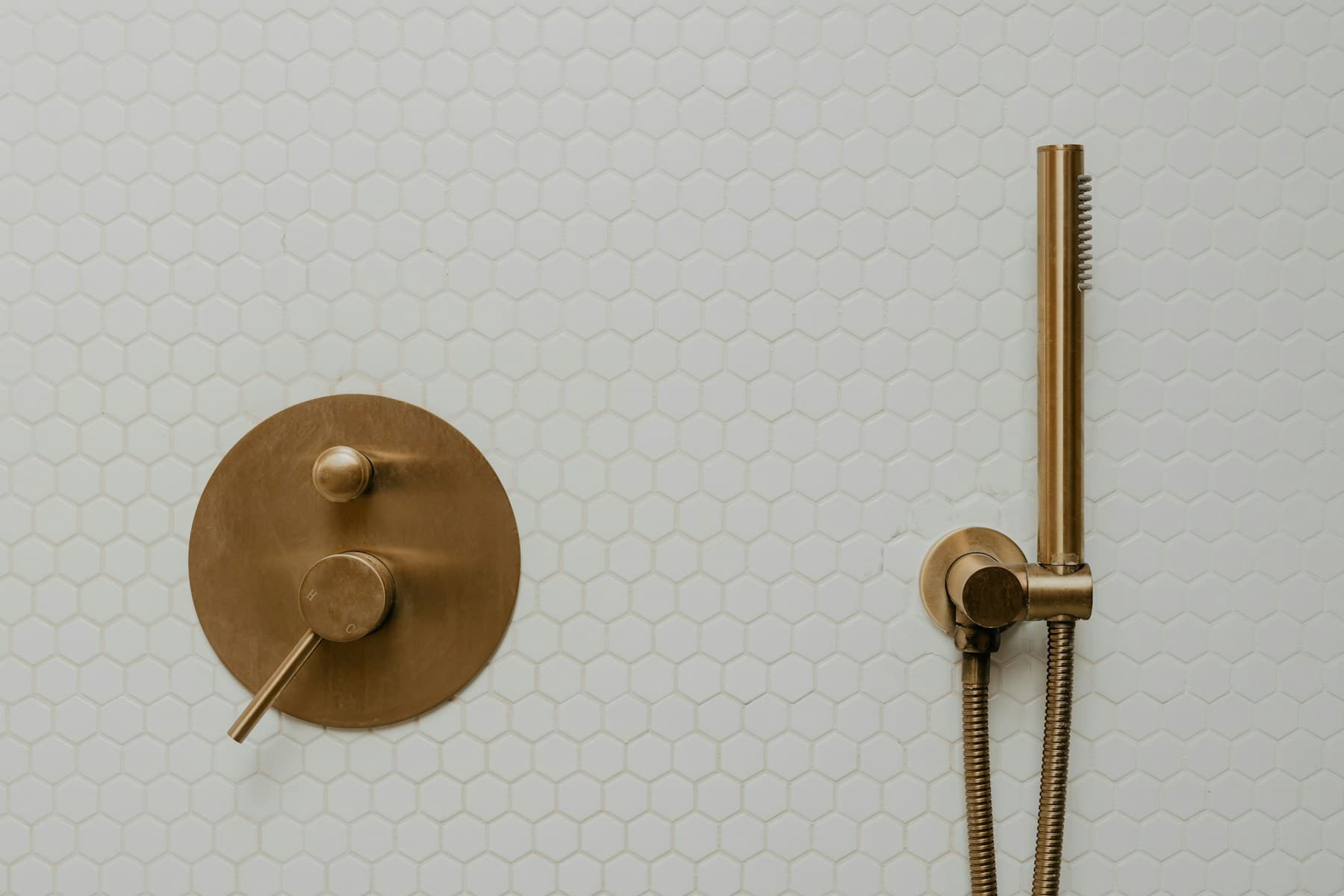 Brass fitting and tiles shown using licensed stock photography