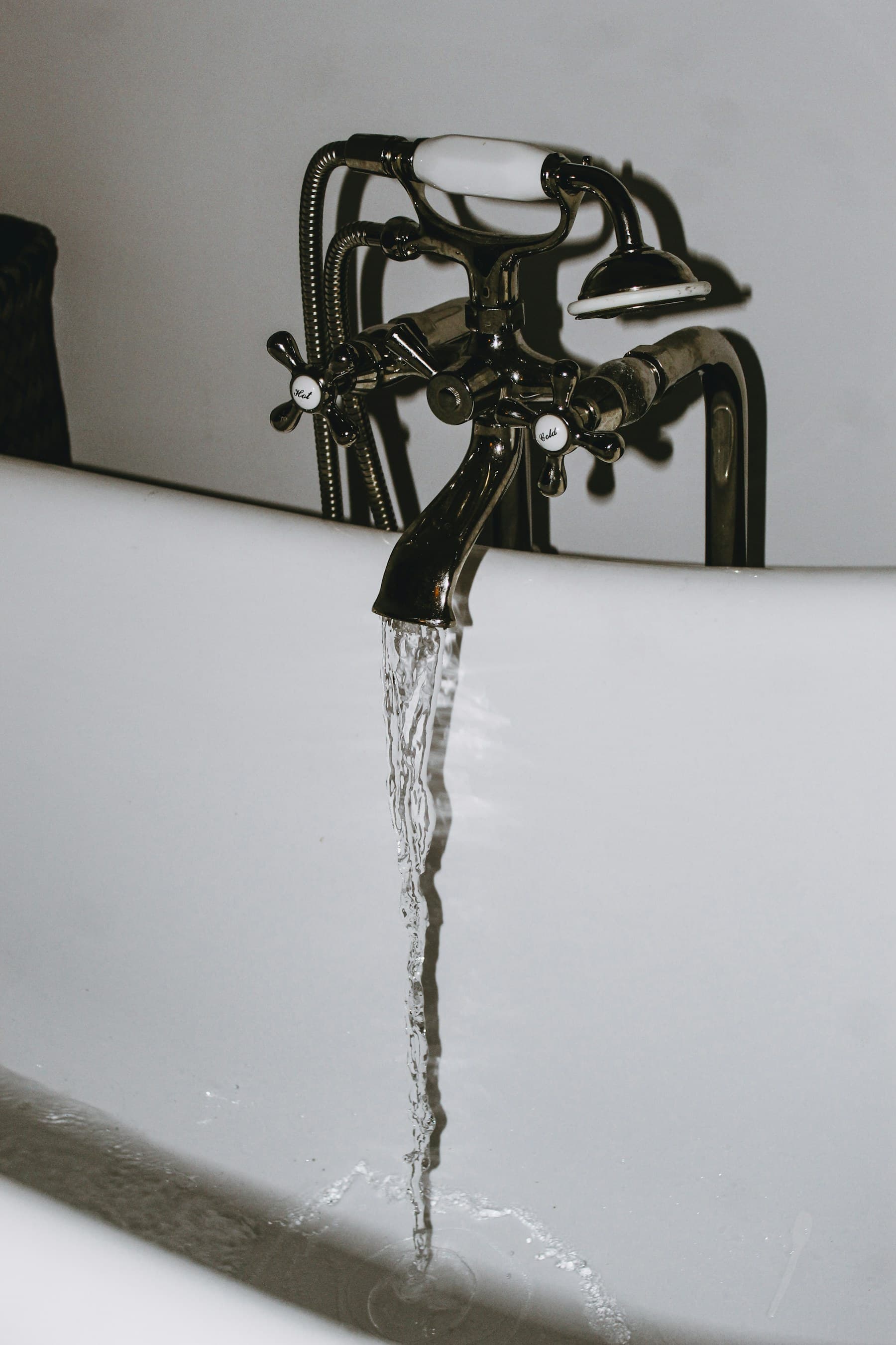 Running water at a bathroom fitting, licensed stock photography